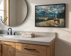 a bathroom scene with a large mirror, a wooden vanity, and a framed painting of a person riding a horse in a mountainous landscape.