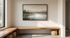 a serene indoor setting with a large landscape painting hanging on the wall above a wooden bench. The painting depicts a tranquil scene of a lake surrounded by mountains, creating a peaceful atmosphere. The bench is situated in front of a window, allowing natural light to illuminate the space and enhance the overall ambiance.