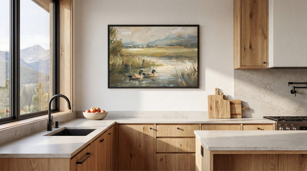 a modern kitchen with a large window overlooking a scenic landscape, featuring a painting of ducks in a pond. The kitchen is equipped with wooden cabinets and a white countertop, and includes a sink, stove, and various kitchen accessories.