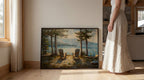 A woman stands next to a large painting depicting a serene landscape with two Adirondack chairs overlooking a lake surrounded by trees.