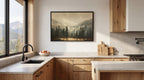 a modern kitchen with a large window overlooking a scenic mountain landscape. The kitchen features wooden cabinets, a black faucet, and a framed landscape painting on the wall.