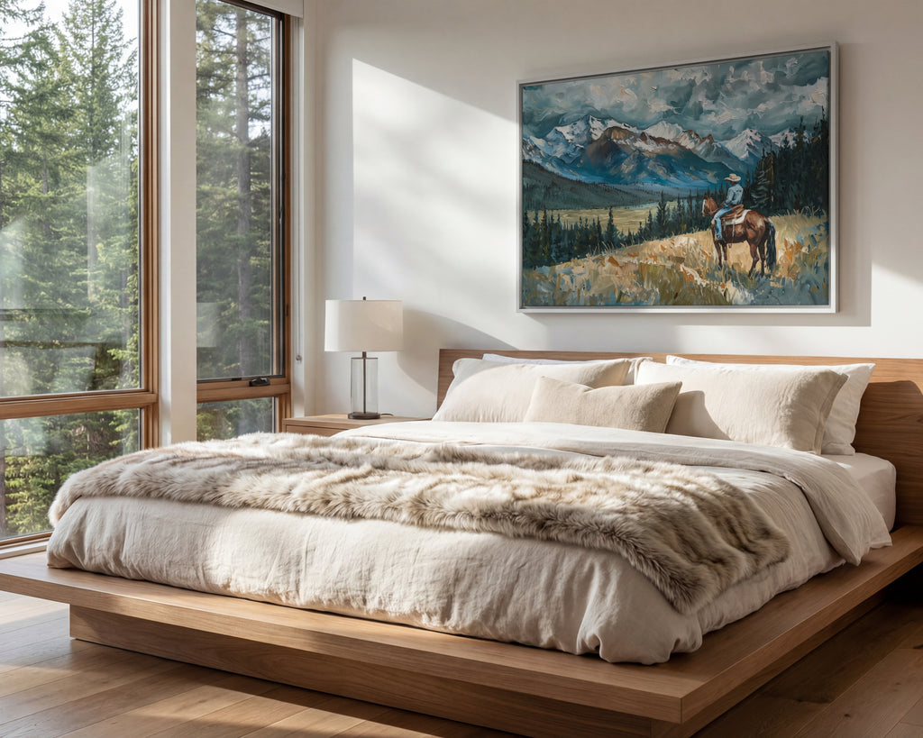 a serene bedroom scene with a large bed, a painting of a person riding a horse, and a window overlooking a forest.