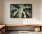 a large painting of a forest scene hanging on a white wall above a wooden bench.