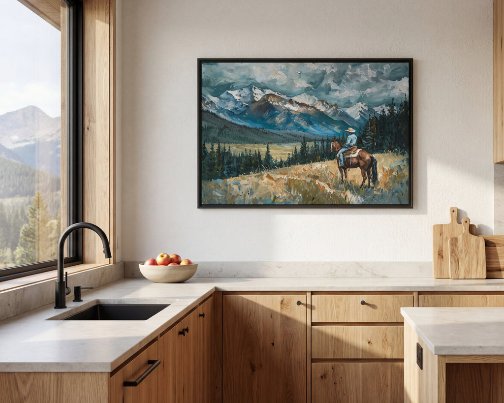 a kitchen with a large painting of a cowboy on a horse hanging on the wall above a wooden cabinet. The painting depicts a scenic mountain landscape with a person riding a horse in the foreground.
