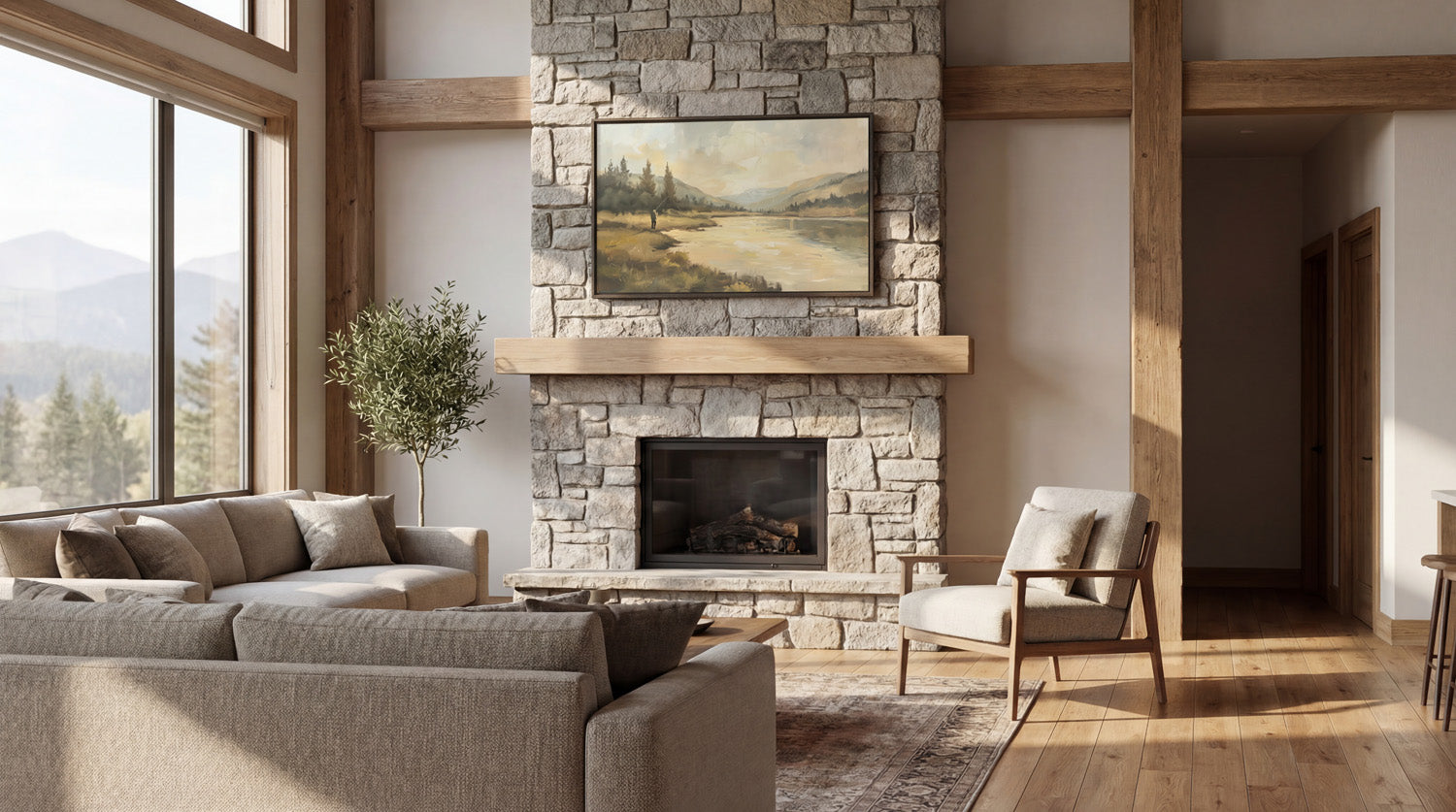 a cozy living room with a stone fireplace, a large window overlooking a scenic mountain landscape, and a comfortable seating arrangement with a couch and a chair.