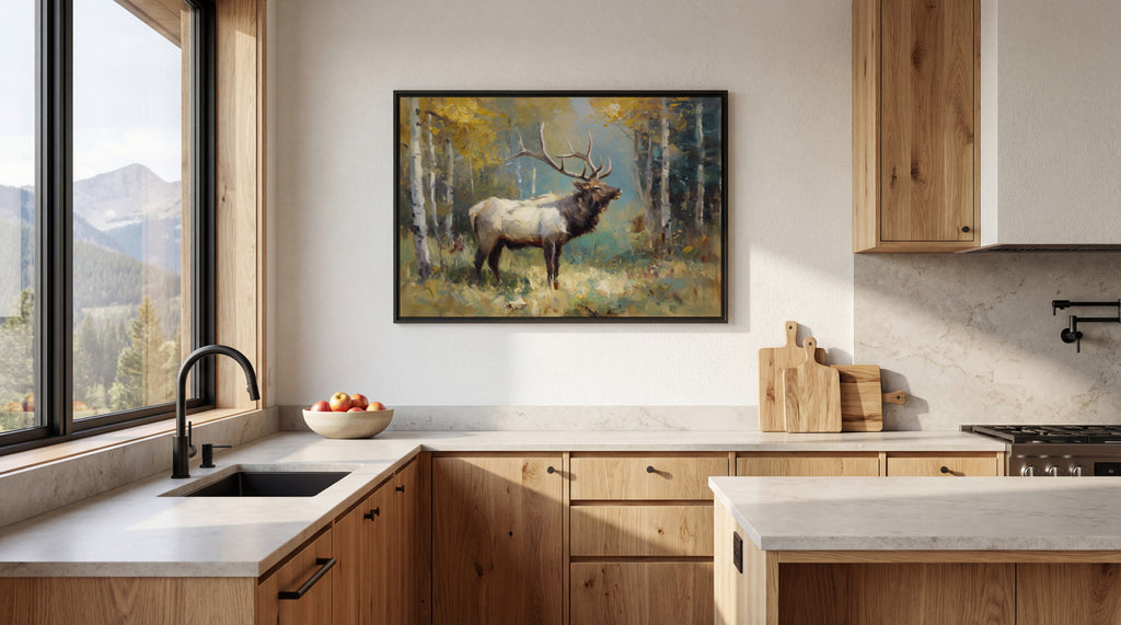 a kitchen with a large window overlooking a forest, and a framed painting of a deer standing in the foreground.