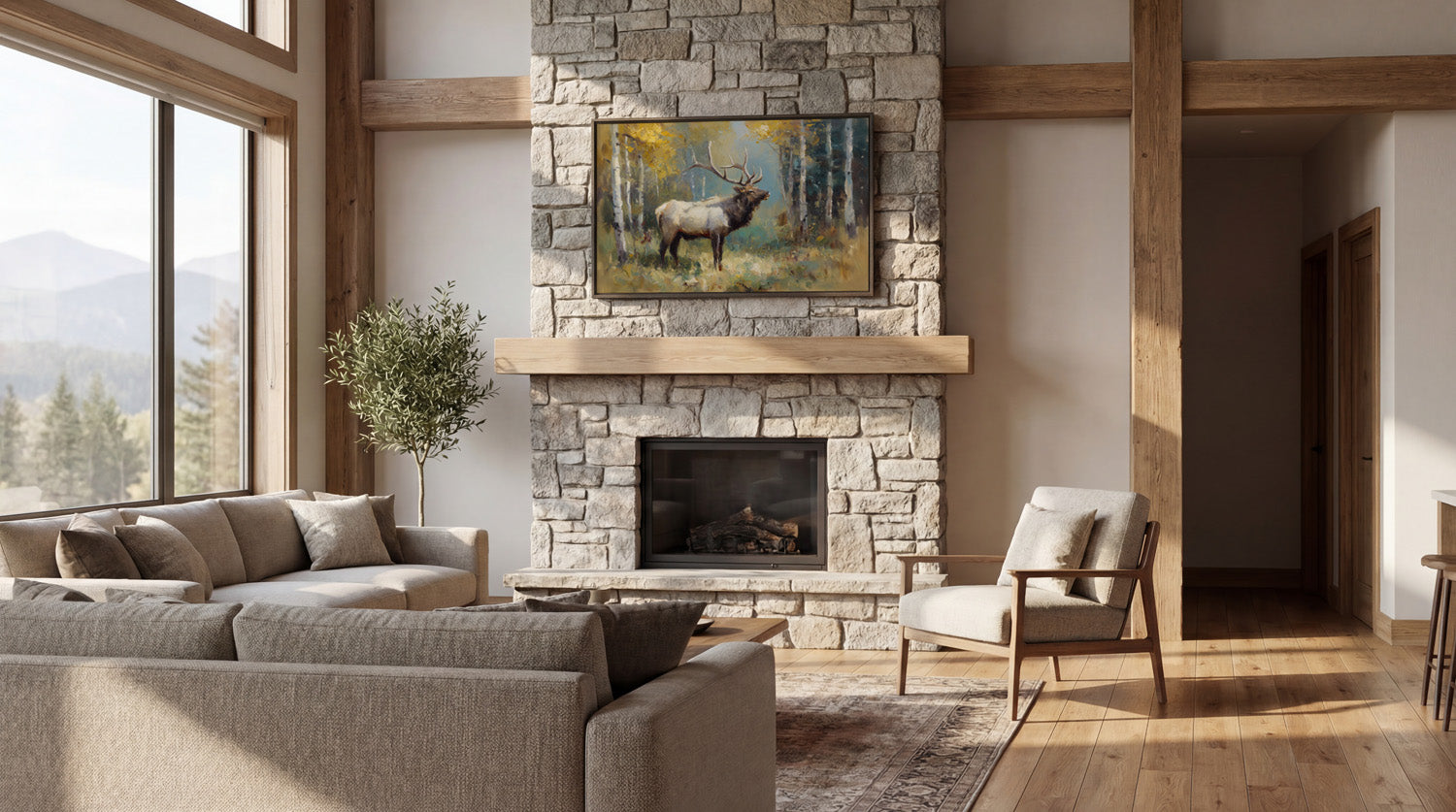 a cozy living room with a stone fireplace, a large window overlooking a scenic mountain view, and a painting of a deer in the background.