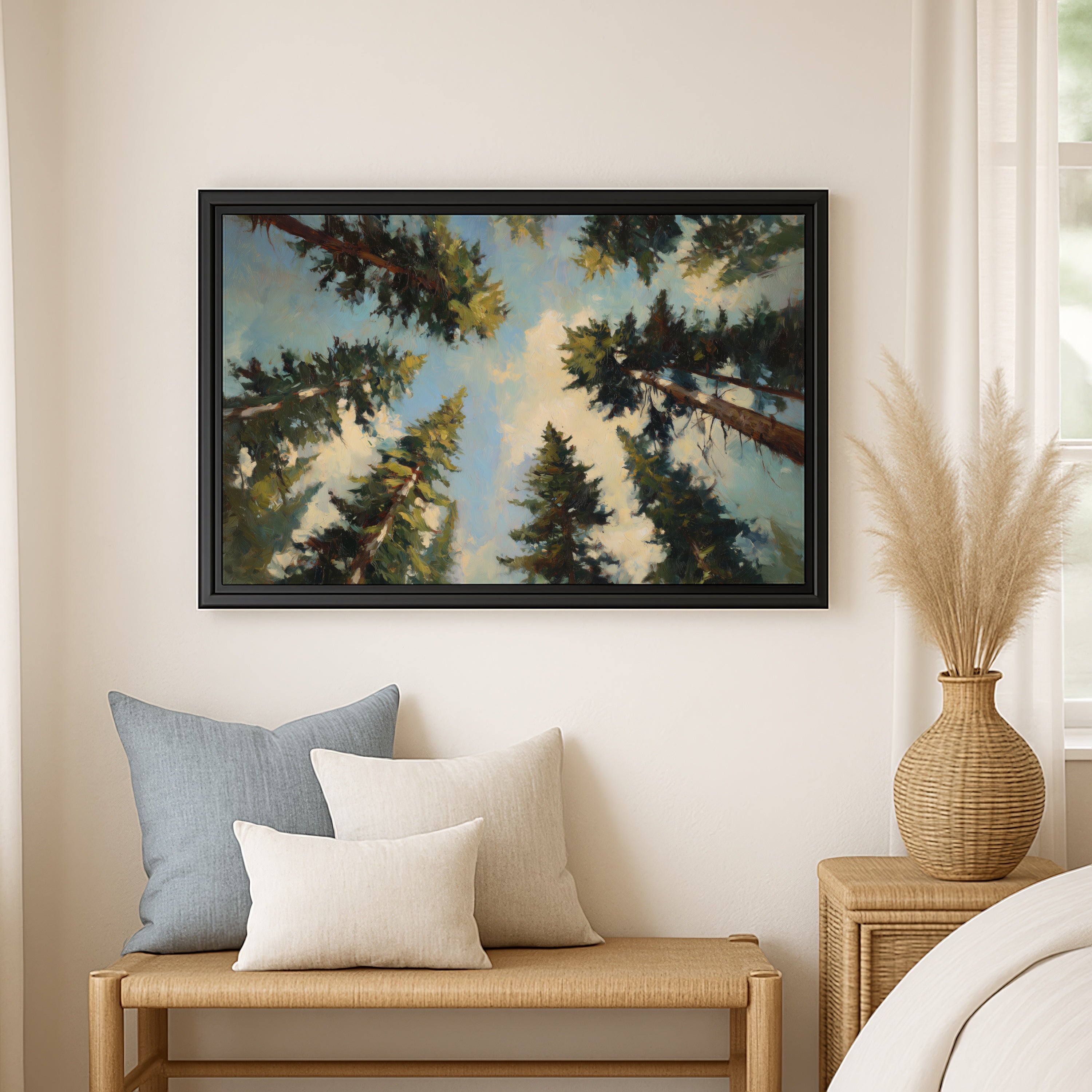 a large framed painting of a forest scene hanging on a wall, with a wooden bench and a woven basket nearby.